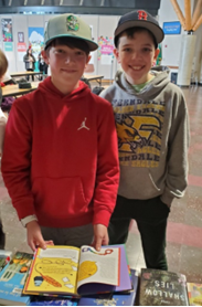 Two students looking at a book