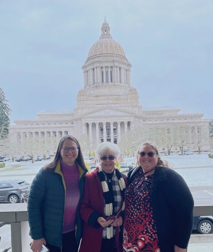 Christine Perkins, Doralee Booth and Di Marrs-Smith in front of the Washington state capital building.