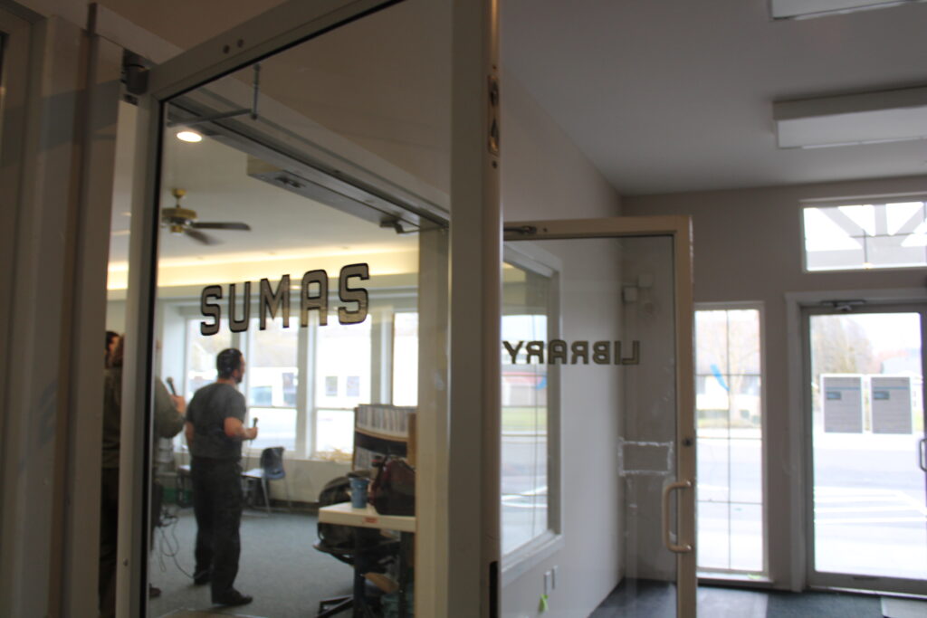 Paul standing in Sumas Library doorway