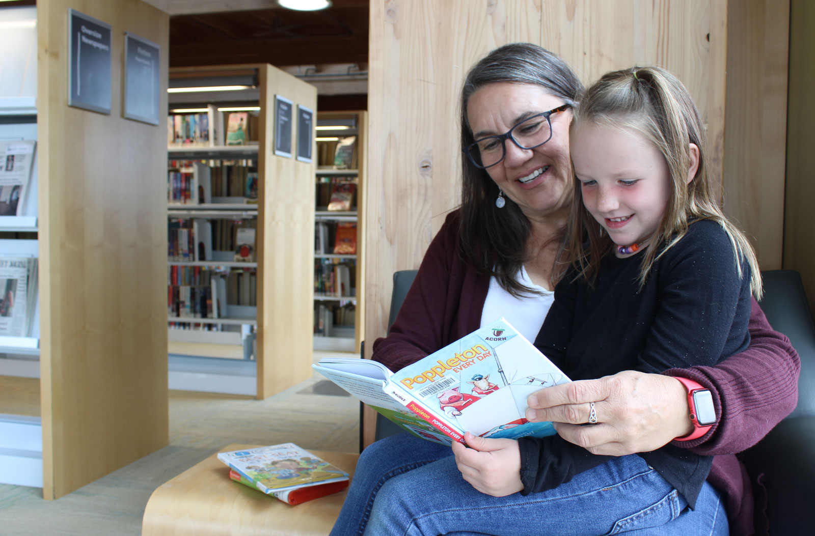 Child reading with grandmother